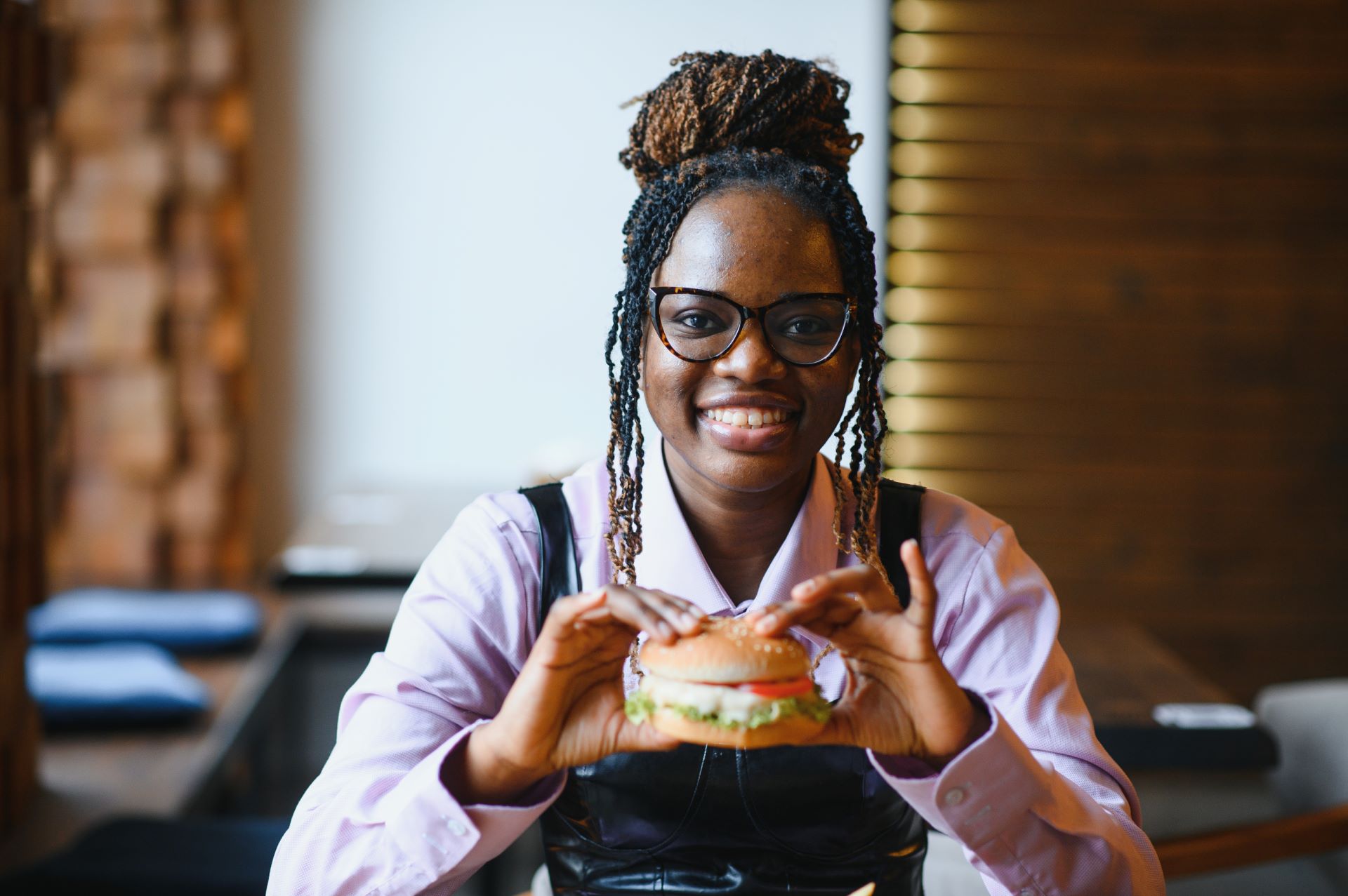 african-girl-eating-burger-and-fries-in-cafe-fast-2025-05-13-04-56-41-utc.jpg